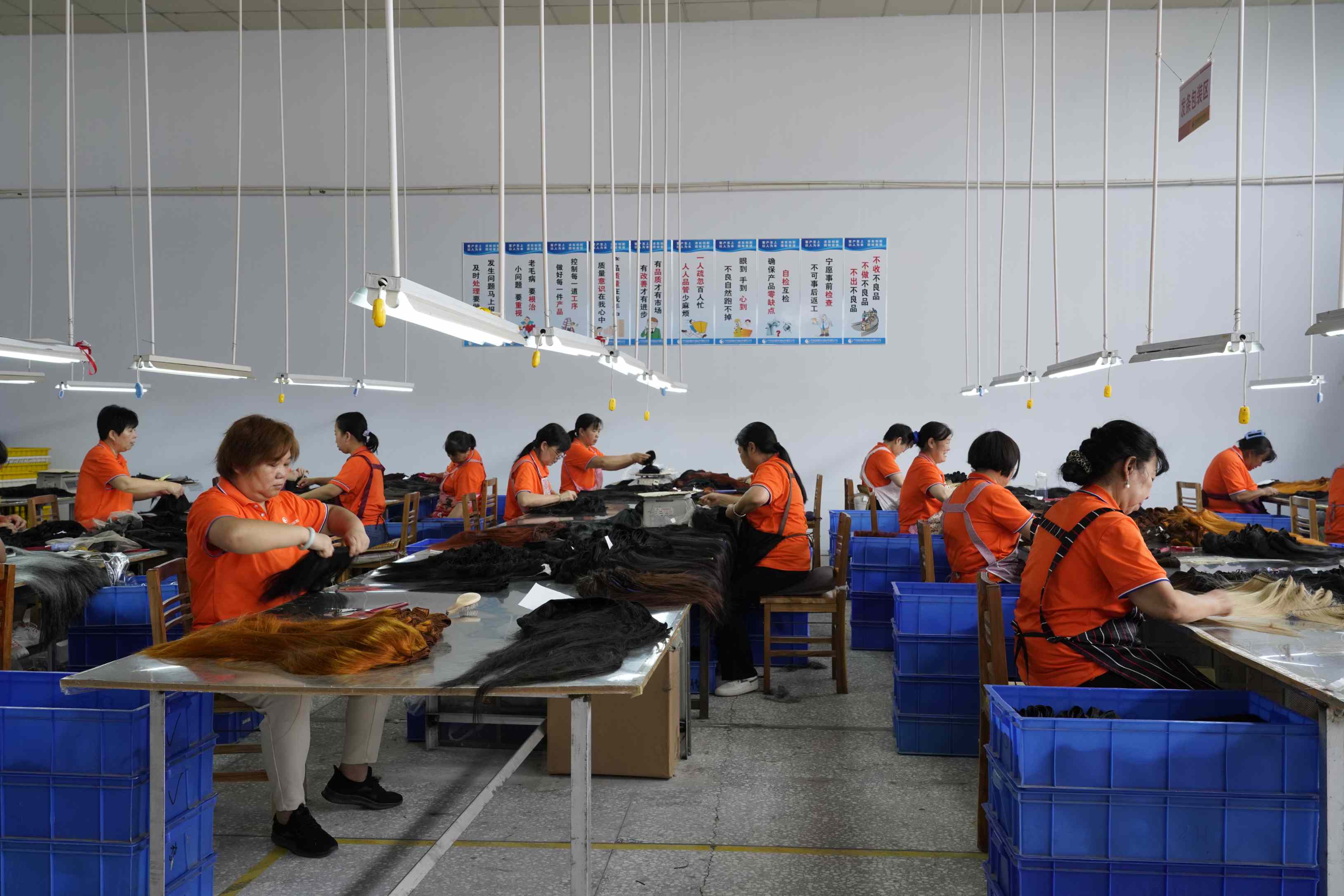 FoxenHair Workers in a completion area handling hair products