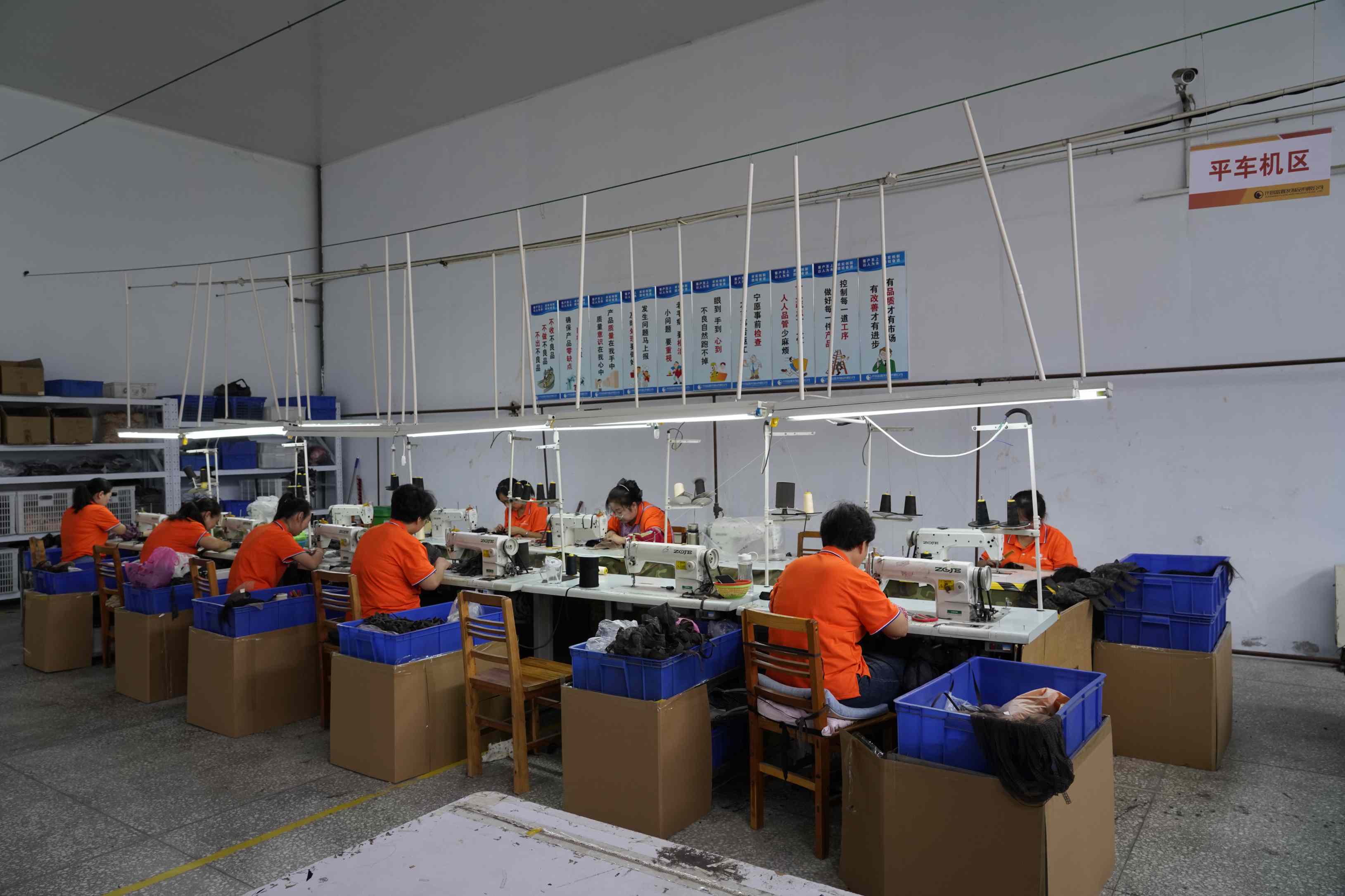 FoxenHair Workers sorting out hair strands in a workshop