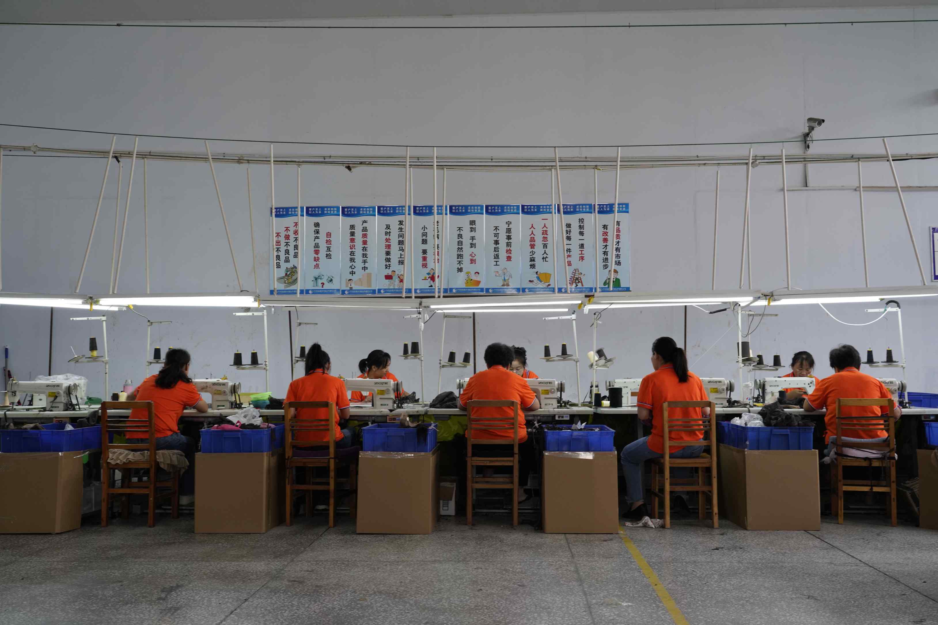 FoxenHair Workers operating sewing machines in a flat - car area